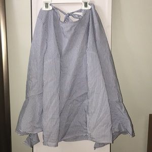 White and blue striped shirt.